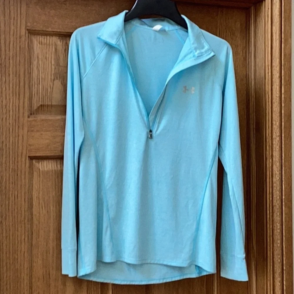 Under Armour light blue, lightweight, fitted quarter zip pullover. Women’s MED